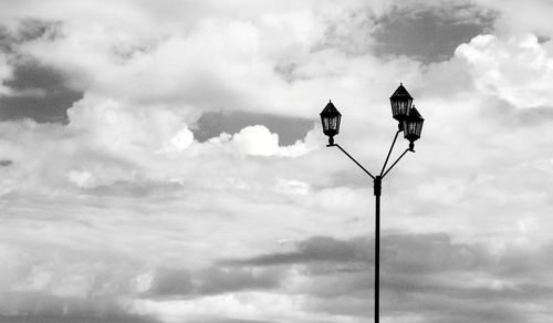Low angle view of street light against sky