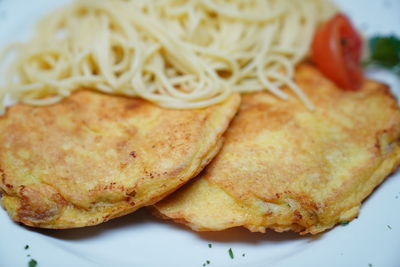 Close-up of meat and bread in plate