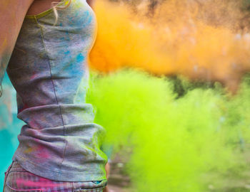 Midsection of woman with powder paint