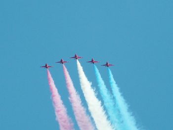 Low angle view of airplane flying in sky