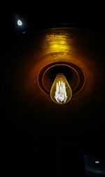 Low angle view of illuminated pendant light