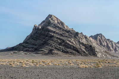 Scenic view of mountain forms like a shark tooth with nice color  and the grass below added beauty