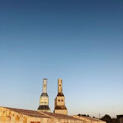 Low angle view of building against blue sky