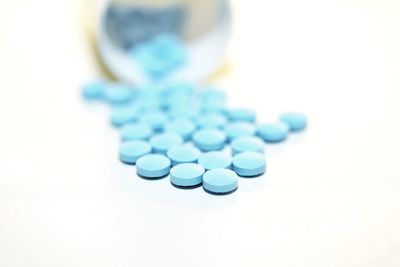 Close-up of bottles against white background