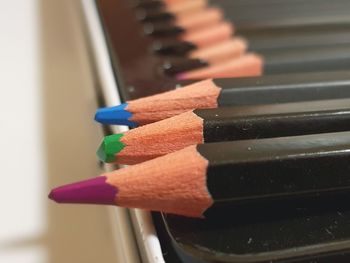 Close-up of colored pencils on table