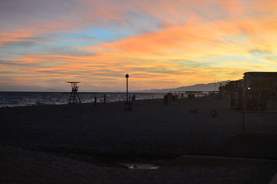 Scenic view of sea against orange sky