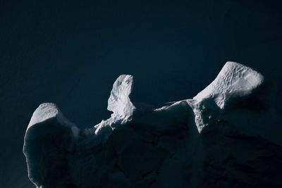 Iceberg against sky