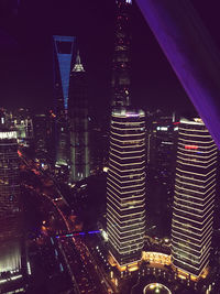 Illuminated buildings in city at night