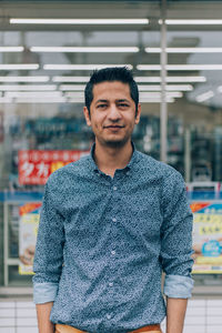 Portrait of young man standing outdoors