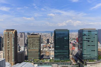 High angle view of buildings in city against sky