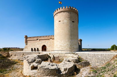 View of fort against blue sky