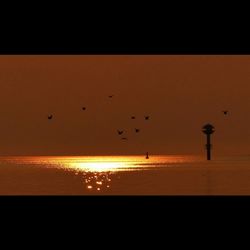 Scenic view of sea at sunset