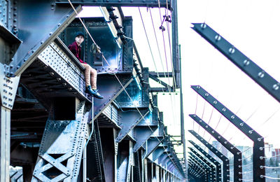 Low angle view of person standing on staircase