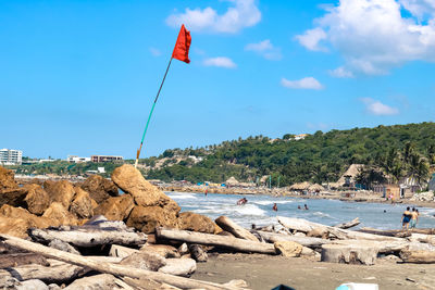 Scenic view of rocks on beach against sky