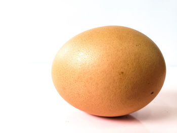 Close-up of eggs against white background