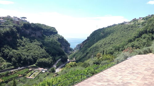 Scenic view of mountains and sea against sky