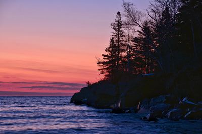 Scenic view of sea at sunset