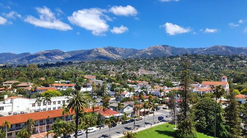 High angle view of townscape and mountains against sky