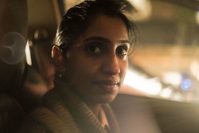 Close-up portrait of woman sitting in car