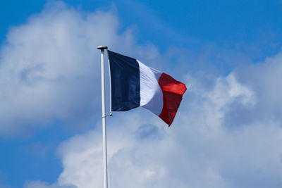 Low angle view of flag against sky