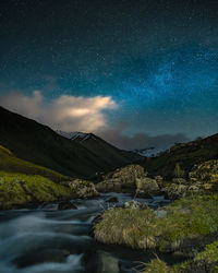 Night landscape with mountain view and stars