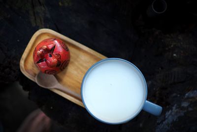 High angle view of hand holding drink