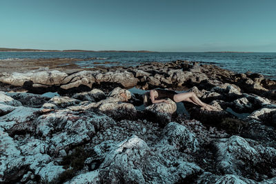 Scenic view of sea against clear blue sky