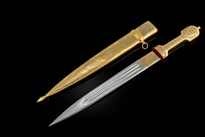 Close-up of pen on black background