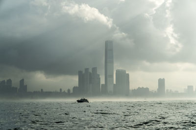 City skyline against dramatic sky