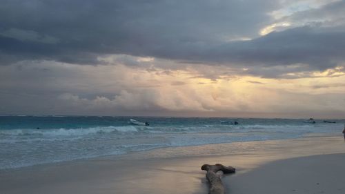 Scenic view of beach against sky during sunset