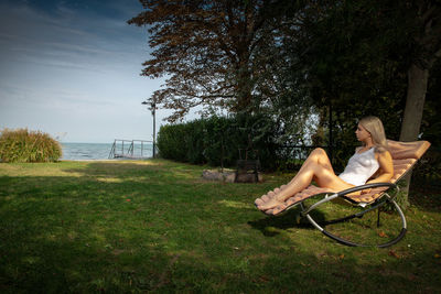 Woman relaxing on field