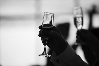 Close-up of hand holding glass of wine