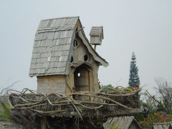 Low angle view of abandoned building against sky