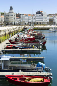 Boats moored in river