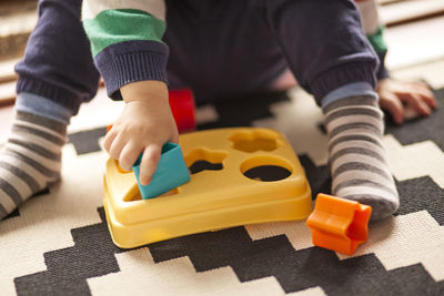 Close-up of boy playing with toy