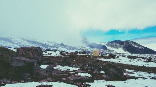 Scenic view of mountains against sky during winter