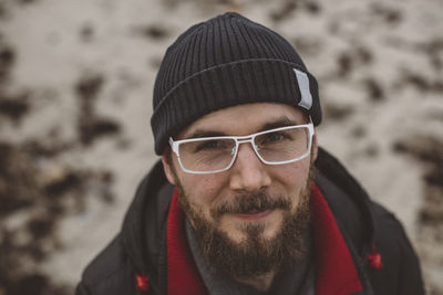 Portrait of young bearded man wearing glasses