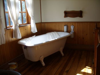 High angle view of woman sitting in bathroom