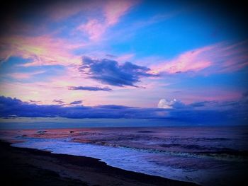 Scenic view of sea against sky at sunset