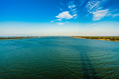 Scenic view of sea against blue sky