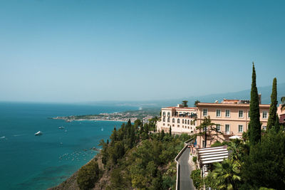 Hotel building in taormina with accommodation for tourists on a hill