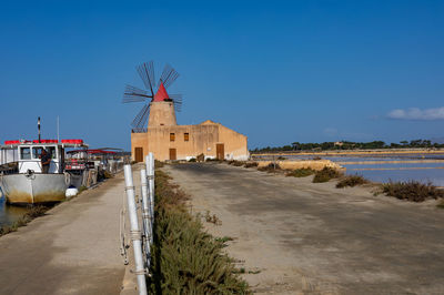 Panoramic view of beach against clear blue sky