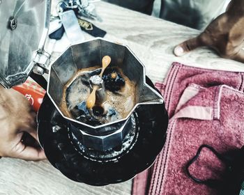 High angle view of person holding drink