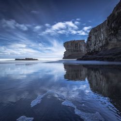 Scenic view of muriwai beach against sky