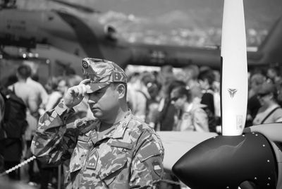 Military officer looking away while standing outdoors