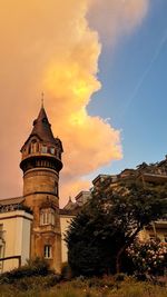 Low angle view of buildings against sky during sunset