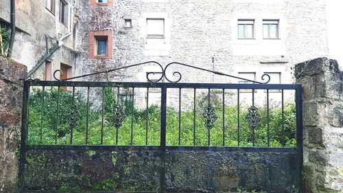 Metal gate against building
