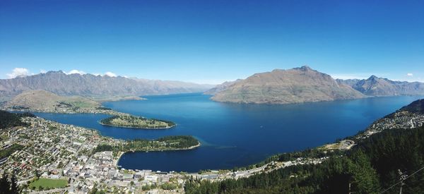 Panoramic view of mountain range against blue sky