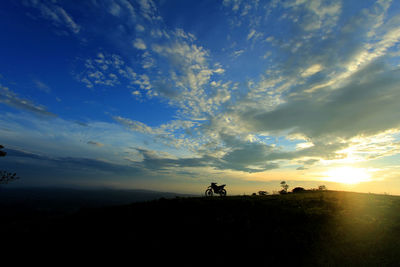 Scenic view of silhouette land against sky during sunset