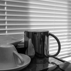 Close-up of coffee cup on table